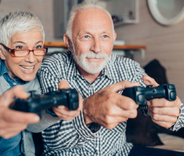 Older couple playing a video game.